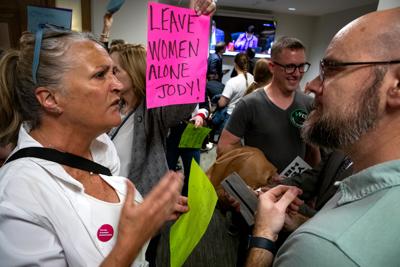 Reproductive rights demonstrators face off against supporters of a bill that would further criminalize abortion in the Cordell Hull State Office Building, March 10, 2026