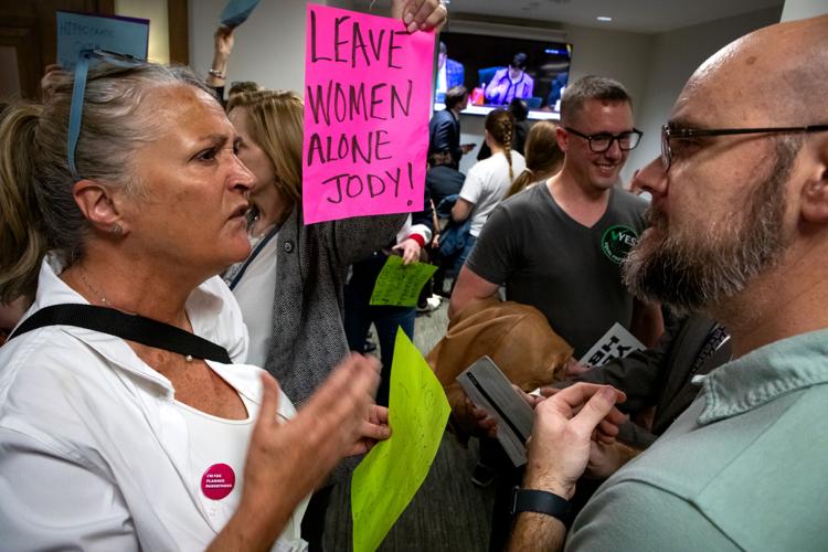 Reproductive rights demonstrators face off against supporters of a bill that would further criminalize abortion in the Cordell Hull State Office Building, March 10, 2026