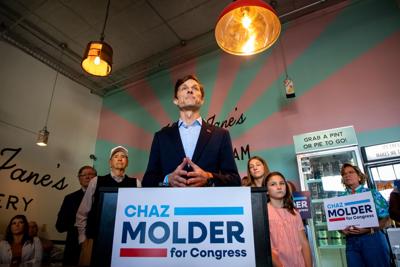 Chaz Molder flanked by family and supporters in Hattie Jane's Creamerie