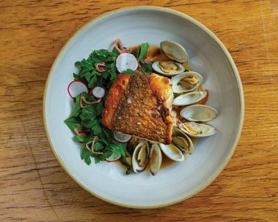 A colorful and beautifully prepared seafood dish at Henrietta Red