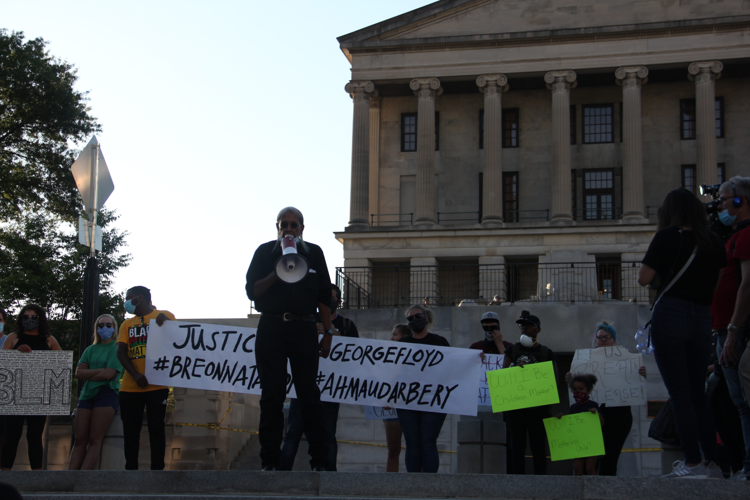 Peaceful Protesters Sing, Chant to Mass of National Guard Members