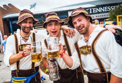 Folks wearing traditional German clothing and holding steins of beer at Oktoberfest, the Nashville Scene’s 2026 Best Beer Event/Beer Festival in Nashville