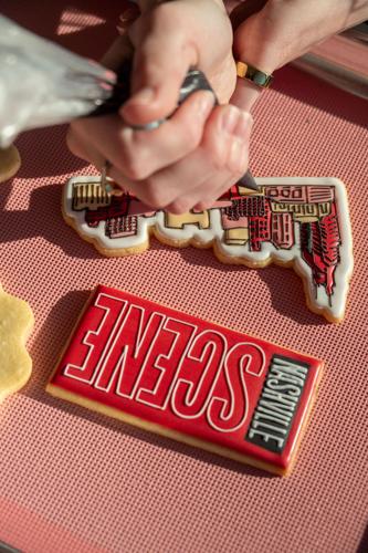 An upside down cookie decorated to look like the red logo of the Nashville Scene