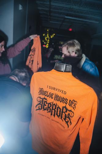 Handing out the preordered commemorative T-shirts at the Belcourt for the 15th annual horror movie marathon 12 Hours of Terror, 10/17/2026.
