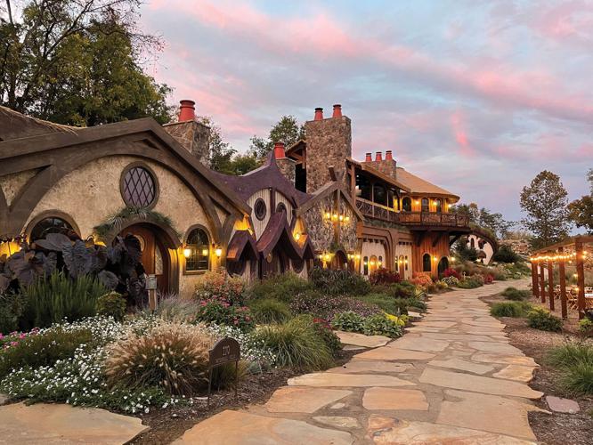 A row of rounded buildings resembling fairytale-style homes along a cobblestone path