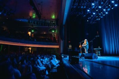 Color photo of Steve Earle performing at the Ryman Auditorium on Aug. 28, 2024
