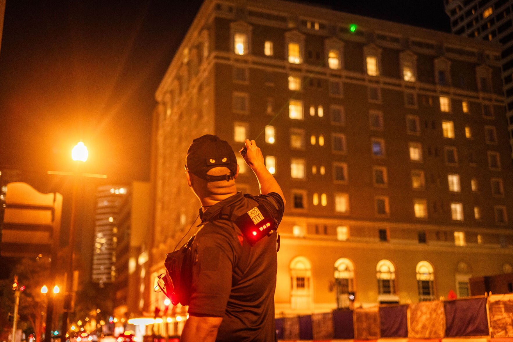 Nestor Ilagan indicates a window with a laser pointer