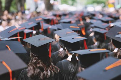 Backside graduation hats during commencement ceremony