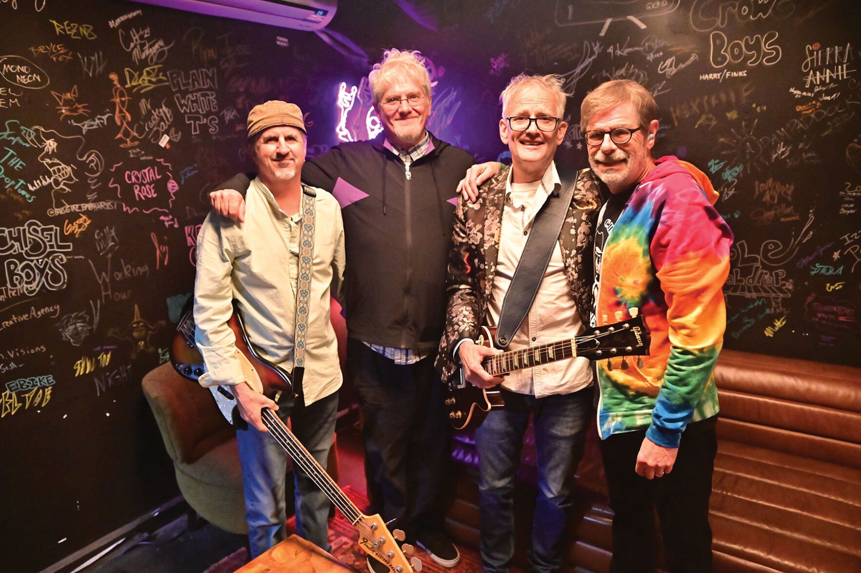 The White Animals photographed standing shoulder to shoulder backstage at Exit/In