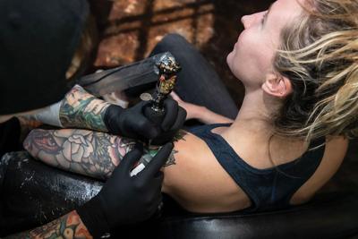 Patron getting an upper arm tattoo at Black 13 Tattoo, the Nashville Scene’s 2026 Best Tattoo Studio in Nashville