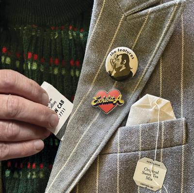 Cover art for The Features’ ‘Exhibit A: Sweet Tea Mix,’ the Nashville Scene’s 2026 Best Rock Reissue, featuring a close-up of a striped blazer with the artist name and title written on fashion buttons on the lapel and a packet of tea sticking out of the pocket