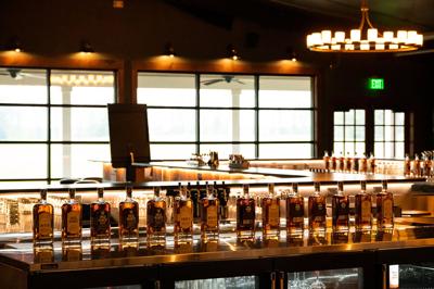 Humble Baron bar lined with whiskey bottles