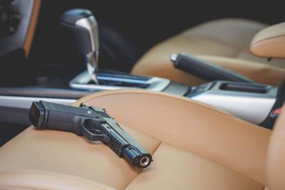 Black gun inside the car