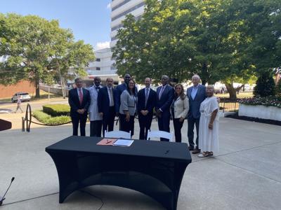 The mayor and leaders from Meharry and Nashville General Hospital pose at the agreement signing