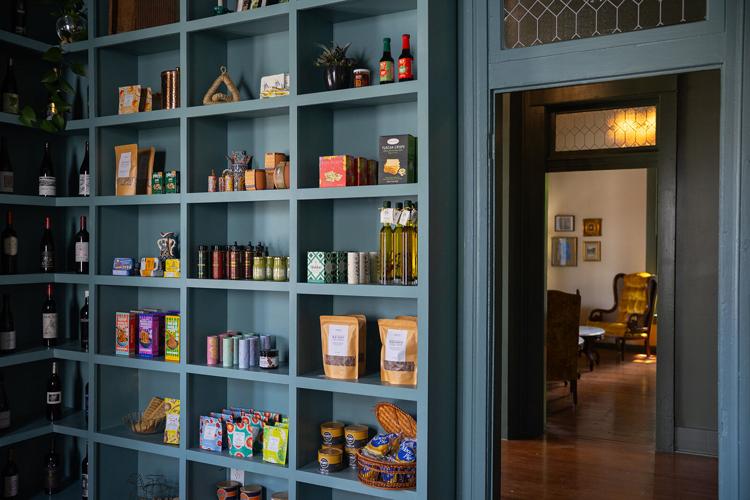 Color photo of items on the shelves in the grocery at Antoinette’s Wine + Provisions in Sylvan Park