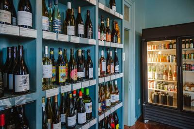 Shelves of wine bottles at Antoinette’s Wine + Provisions