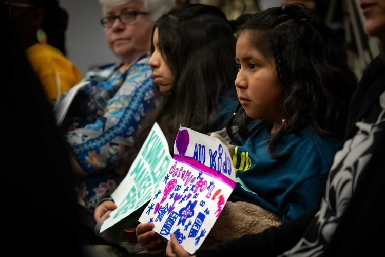 Children hold signs in opposition to HB 793, March 11, 2025