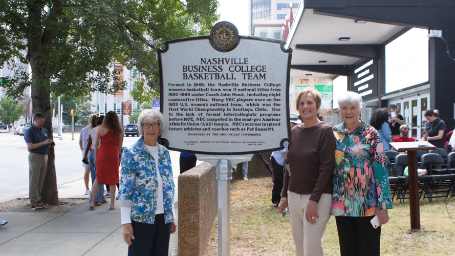 Former members for the Nashville Business College women's basketball team pose with the team's new historical marker, Oct. 1, 2026