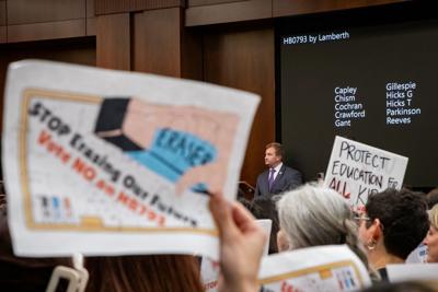 House Majority Leader William Lamberth stands by as protesters hold signs in opposition of House Bill 793, March 4, 2026