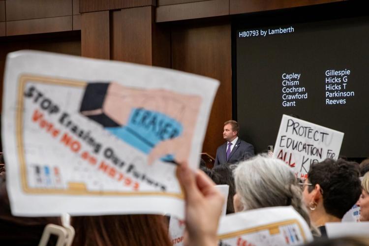 House Majority Leader William Lamberth stands by as protesters hold signs in opposition of House Bill 793, March 4, 2026