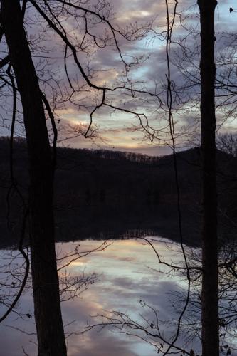 Radnor Lake at sunset, with the sky reflected in the lake's water