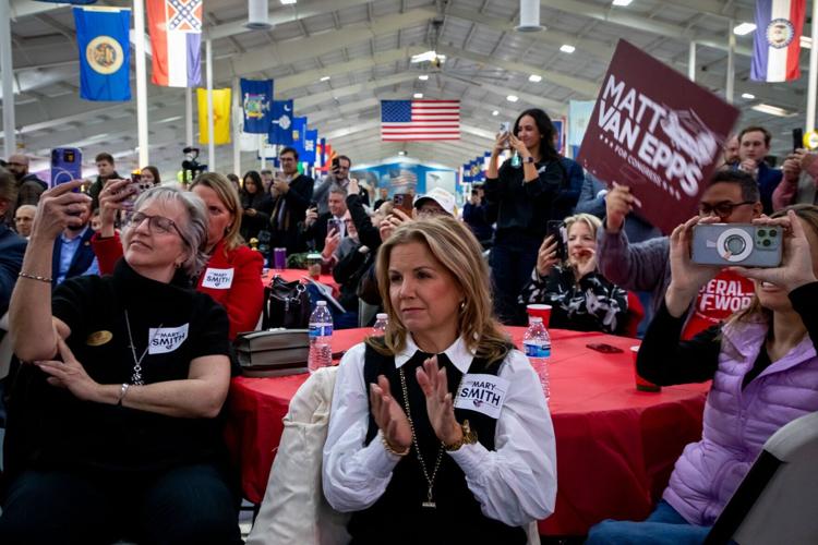 Republican voters applaud as Speaker Mike Johnson calls President Trump during a Franklin rally, Dec. 1, 2025