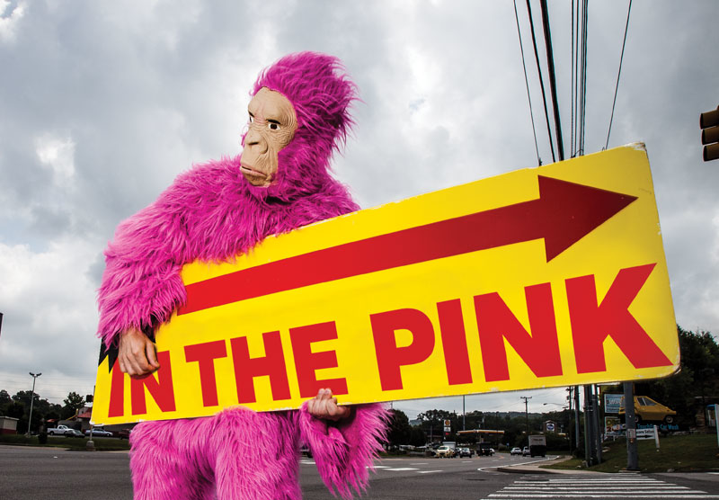 Ever wondered what it's like inside those sign-flipping mascot costumes? So did our reporter — until he went ape