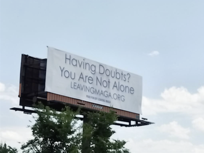 A billboard that reads “Having doubts? You are not alone. Leavingmaga.org”