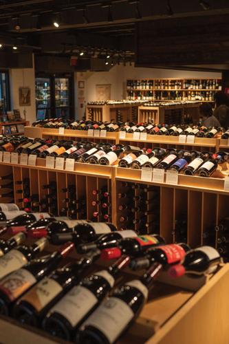 Rows of bottles of wine in a store