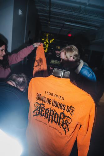 Handing out the pre-ordered commemorative T-shirts at the Belcourt for the 15th annual horror movie marathon 12 Hours of Terror, 10/17/2026.