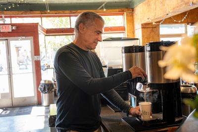 Bob Bernstein getting a cup of coffee at Fido