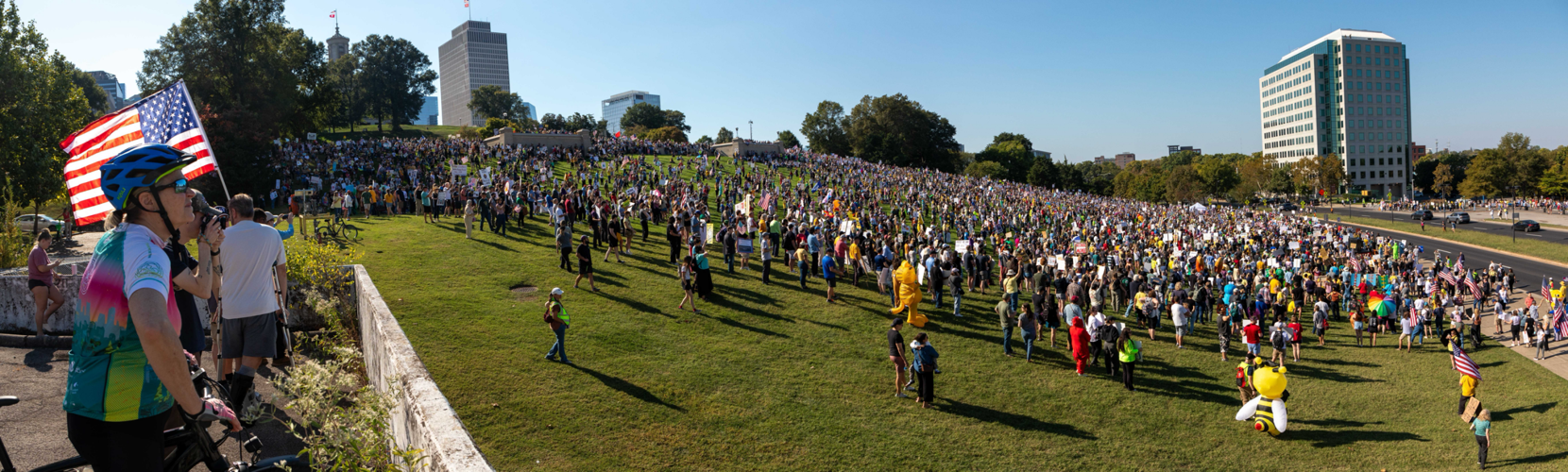 A panoramic view of the Tennessee State Capitol lawn, filled with protesters