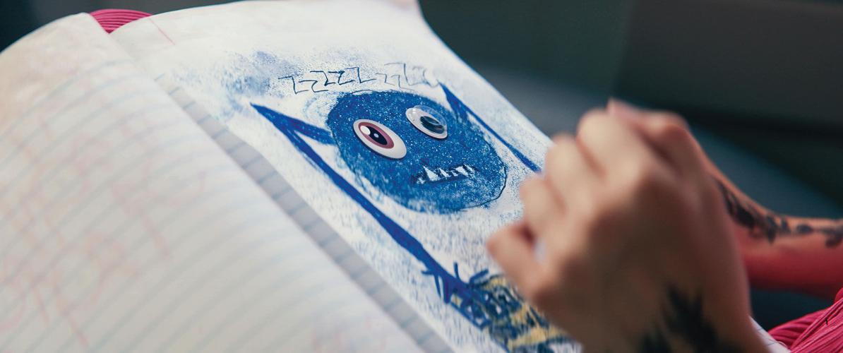 Children's drawing a of a blue, spider-like monster from the movie 'Sketch'