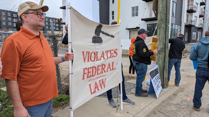 Labor advocates rally outside the construction site at 1330 Dickerson Pike