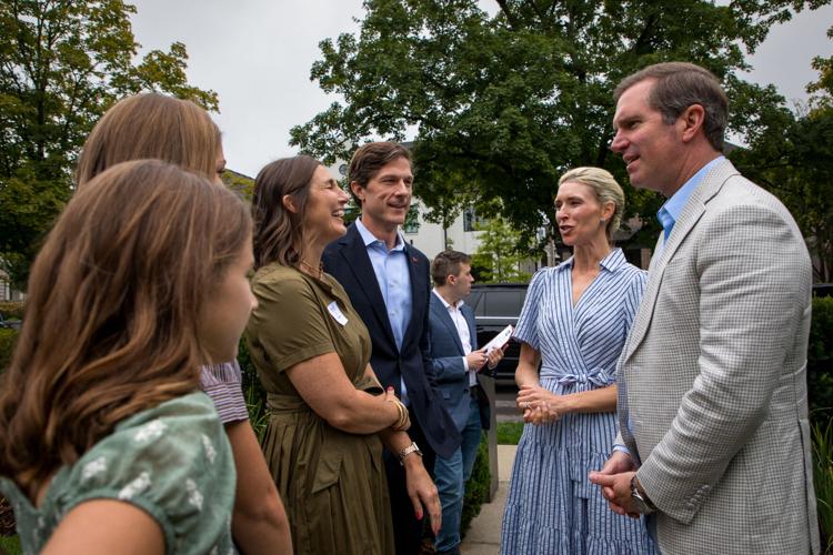 Chaz Molder (center) and Gov. Andy Beshear speak at a fundraising event in Nashville, Oct. 3, 2026