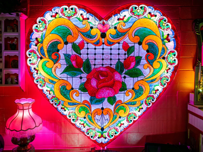 Color photograph of a light-up stained-glass heart sculpture at Mirror Mirror Network