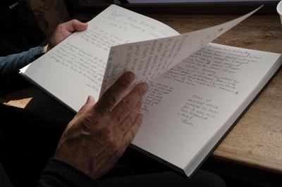 Bob Bernstein looks through the guest book in Fido’s lobby