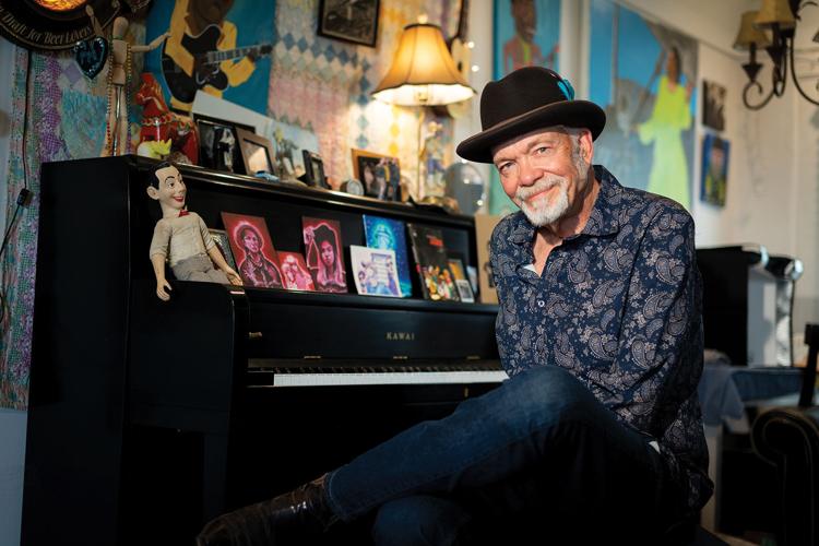 Phil Madeira press photo 2025 the artist sits at a piano