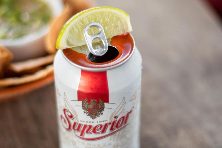 Superior Cerveza dressed with Cholula and lime