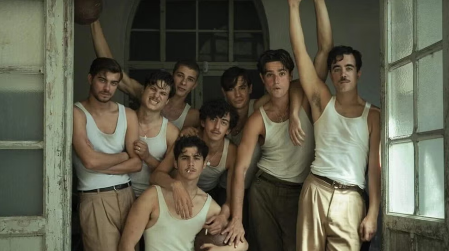 A still featuring the cast of La Bola Negra, standing in a doorway