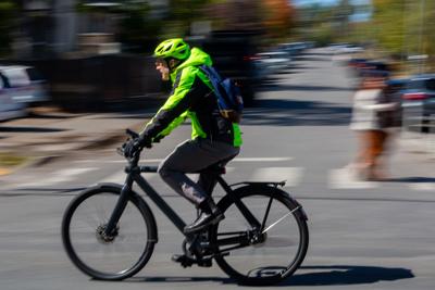 A cyclist on the move in 12South wearing reflective gear