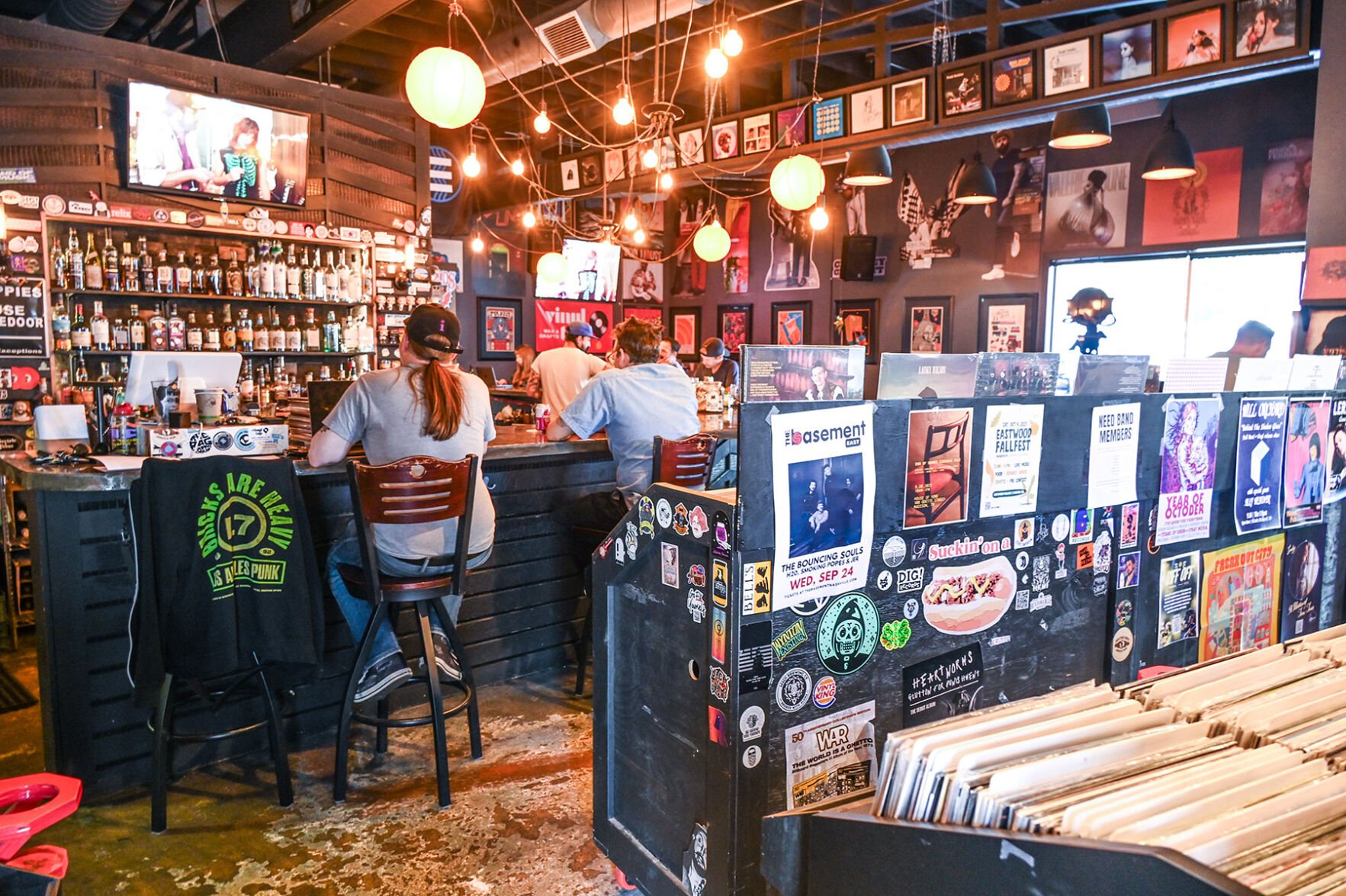 People sitting at the bar at Vinyl Tap