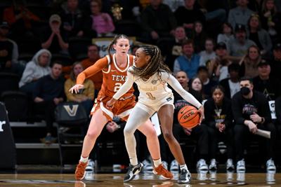 Vanderbilt's Mikayla Blakes drives toward the basket against Texas' Ashton Judd at Memorial Gymnasium, Feb. 12, 2026