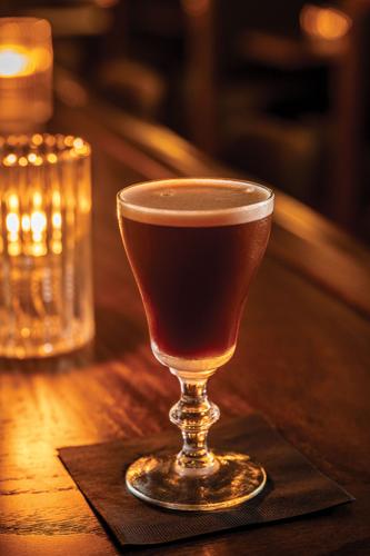 A cocktail resting on the Patterson House's bar