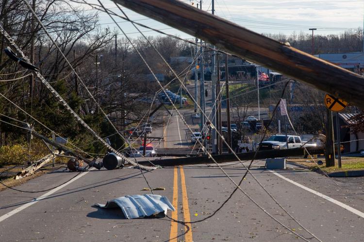 Utility poles, power lines and debris scattered across Madison's Nesbitt Lane on Dec. 10