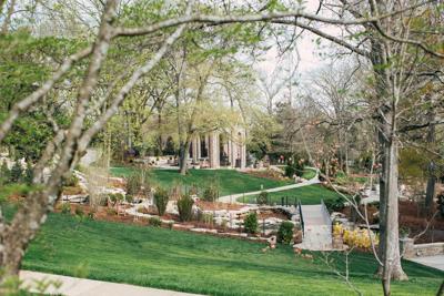 Stone pathway cuts through the rolling grassy hills of Cheekwood