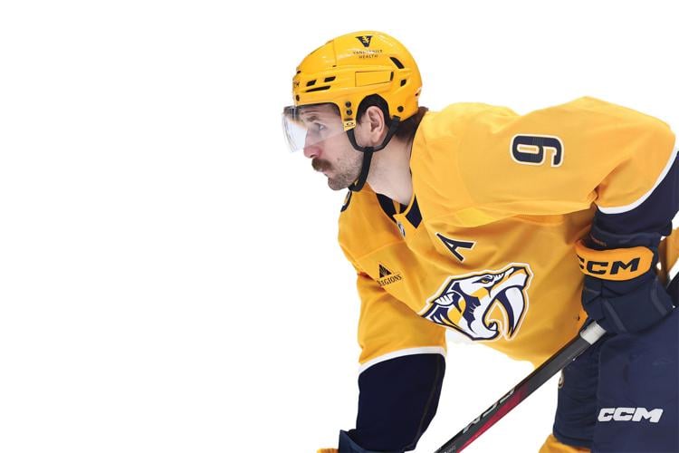 A photo of Nashville Predators forward Filip Forsberg looking intently down the ice.