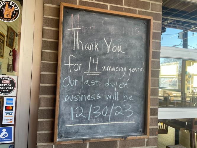 Chalkboard sign outside The Wild Cow reads: "Thank you for 14 amazing years! Our last day of business will be 12/30/23."