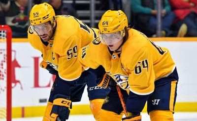 Roman Josi (left) and Mikael Granlund