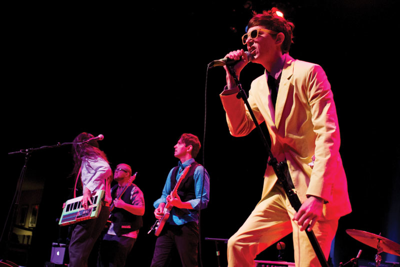 A local glam-rock goof-off and his goon squad land the gig of a lifetime: opening for The B-52s at the Ryman
